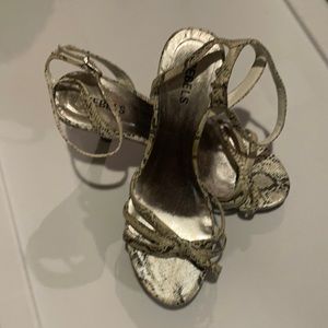 SNAKE SKIN STRAPPED HEELS...